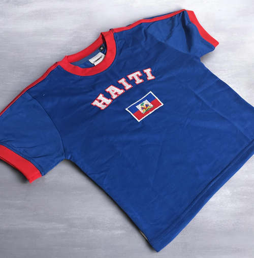 Blue Haiti Baby Tee with red stripes, haitian flag centered with curved white "HAITI" outlined in red 
